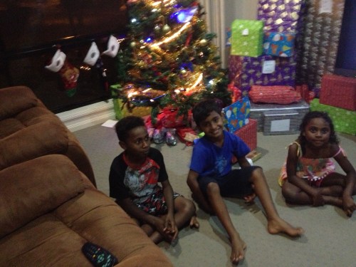 the 3 "little" kids looking like angels... well, not really...